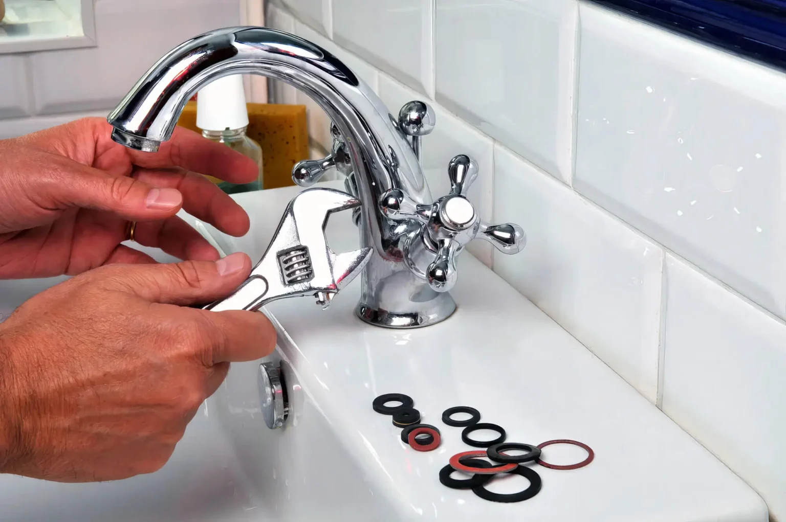 Plumber maintaining a bathroom faucet in North Highlands