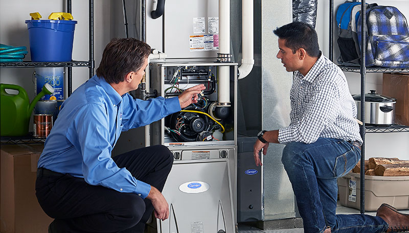 Technician evaluating a furnace for repair or replacement in North Highlands