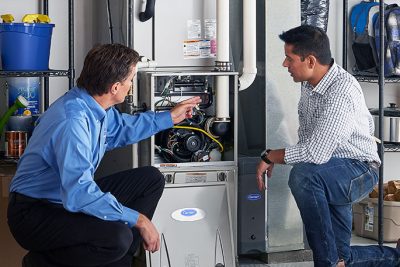 Furnace Repair or Replacement North Highlands Technician evaluating a furnace for repair or replacement in North Highlands